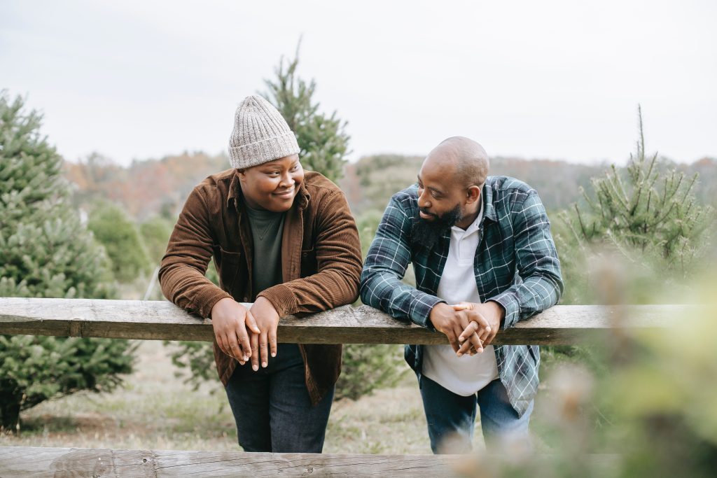 two men standing and talking
